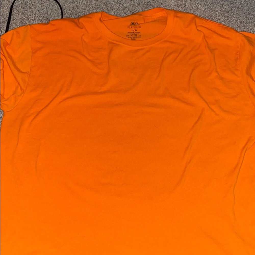 a orange shirt.